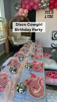 a birthday party with pink and silver decorations