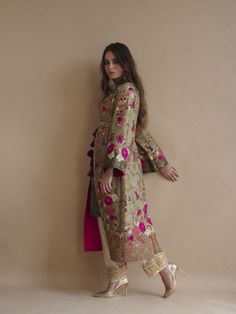 Style Digitally printed pure raw silk inspired by mughal miniatures styled as long front open coat with printed inner. Hand-worked colored aar floral motifs on galla, front and sleeves border. Gold tilla outlines on front border enhancing print. edging of hand-worked pattis in antique sequence and beads and resham flow Open Coat, Plain Pants, Embroidered Pants, Silk Shawl, Designer Outfits, Indian Designer Outfits, Fabric Belt, Indian Designer, Floral Motifs