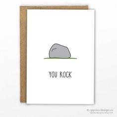 a card with an image of a rock on the ground that says, you rock