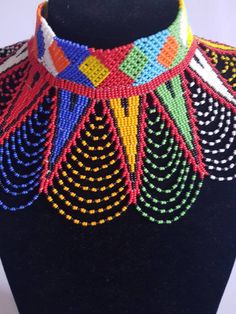 This shoulder necklace is made using colorful fine beads. Perfect for weddings or African themed events. **Buy multiple items and pay shipping for 1 item only.The rest ships free. More neckleces here; https://www.etsy.com/shop/TribalTess?ref=seller-platform-mcnav&section_id=21306083 Back to my shop; https://www.etsy.com/shop/TribalTess?ref=seller-platform-mcnav Multicolor Beaded Choker With Round Beads, Colorful Round Beads Necklaces For Party, Multicolor Tiny Beads Jewelry For Party, Colorful Beaded Chain Necklace For Party, Colorful Beaded Chain Necklaces For Party, Multicolor Beaded Choker, Multicolor Large Beads Choker, Multicolor Necklaces With Colorful Beads For Party, Elegant Multicolor Beaded Bridal Necklace