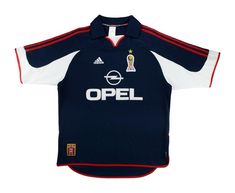 a soccer jersey with the word opel on it and an image of a trophy