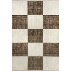 a brown and white rug with checkered squares on the front, in different colors