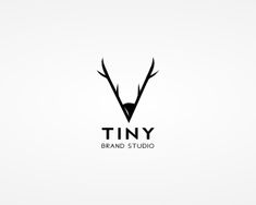 the logo for tiny brand studio, which is designed to look like an antelope's head