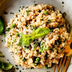 a white plate topped with rice and broccoli