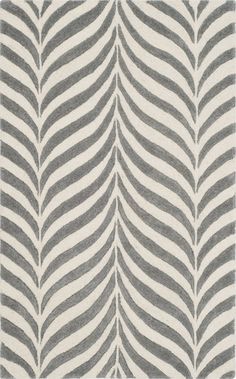 a gray and white rug with wavy lines