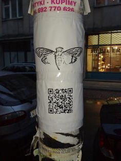 a large white bag wrapped in plastic on the side of a street