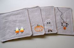 four pieces of cloth with embroidered designs on them