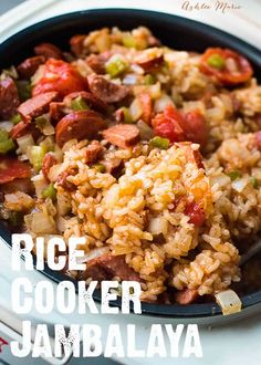 rice cooker jambalya with sausage and peppers in a black bowl on a white plate