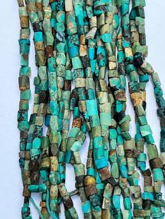 several pieces of turquoise and brown glass beads