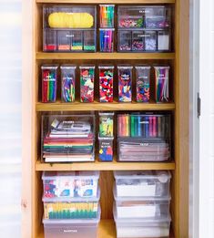 an open book with lots of crafting supplies on it's shelves and drawers