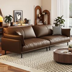 a living room filled with furniture next to a window