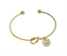 PRICES MAY VARY. Show your pride by wearing this elegant infinity sorority love knot bracelet bangle. It is ADJUSTABLE. It will fit a small to a large wrist. A firm bend will adjust to your desired size. One Size Fits All. Adjust it according to the bracelet size you want. Officially Licensed sorority item Packaging: Each bracelet comes in nice cotton filled gift box, great for gift giving and makes a meaningul gift (please note: color of cotton gift box may vary from picture). See our large sel Love Knot Bracelet, Sorority Jewelry, Cotton Gift, Delta Gamma, Delta Zeta, Knot Bracelet, Cotton Gifts, Love Knot, Bracelet Bangle