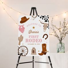 a welcome sign for a baby's first rodeo themed party with cowboy boots and other items