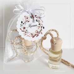 a bottle with a wooden stopper next to a string wrapped bag and tag that says mama on it