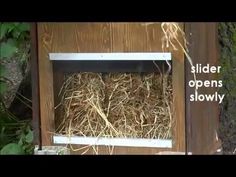 a close up of a bird house with hay in it's window and the words slider opens slowly