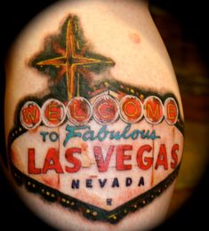 the las vegas sign has been tattooed on someone's arm for years to come