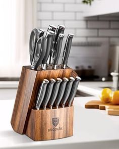 a wooden block with knives in it on a counter