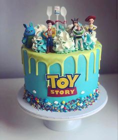 the toy story cake is decorated with toys