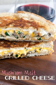 two grilled cheese sandwiches with mushrooms and melted cheese