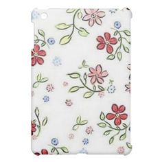 a white ipad case with red and blue flowers on the cover for the ipad mini