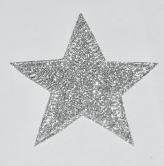 a silver glitter star on a white background