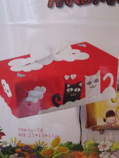 a red box with white cats on it