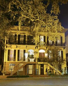 an old building with many balconies lit up at night