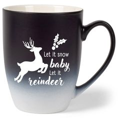 a black and white coffee mug that says let it snow baby, let it reindeer