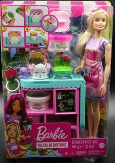 the barbie doll is standing in front of her toy kitchen