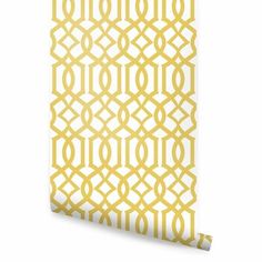 a yellow and white wallpaper with an intricate design on it's side,