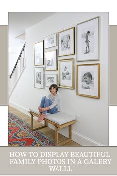 a woman is sitting on a bench in front of some framed pictures with the words how to display beautiful family photos in a gallery wall