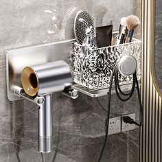 a bathroom sink with a hair dryer, brush and other items on the wall