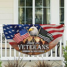 an american flag and two bald eagles on a porch with the words veterans honoring all who served