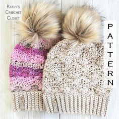 two crocheted hats with pom - poms on top, one in pink and the other in beige