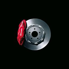 the brake pad and rotor of a car on a black background with space for text