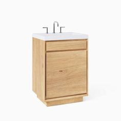 a wooden sink cabinet with two faucets on the top and one drawer below