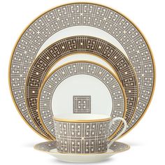 an image of a set of dinnerware with gold trimmings on the rim