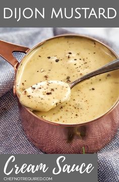 creamy cream sauce in a copper pot with a spoon on the side and text overlay that reads, dijond mustard