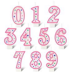 birthday candles with numbers and stars in pink, white and blue colors on top of each candle