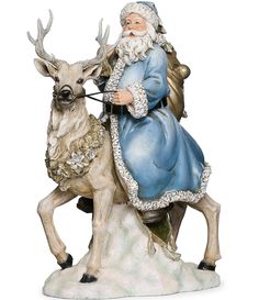 a statue of santa claus riding a deer