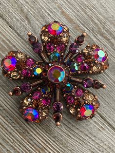 "Stunning Joan Rivers Copper Colored And Pink Iridescent Rhinestones Classic floral Brooch Circa 1990's Excellent condition Signed Joan Rivers Very nice quality....weighty Copper colored finish with pink and gold iridescent rhinstones Floral shaped Classic and timeless 2\" wide" Red Aurora Borealis, Copper And Pink, Pink Iridescent, Jewelry Brooch, Floral Brooch, Joan Rivers, Textile Jewelry, Rhinestone Jewelry, Copper Color