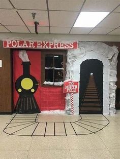 a train themed classroom door decorated with fake snow and paper mache for the doors