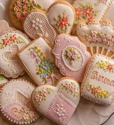 some decorated cookies are sitting on a plate