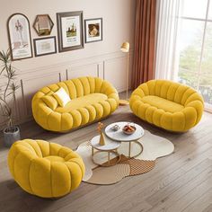 a living room with yellow furniture and pictures on the wall