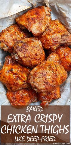 chicken thighs in a basket with the words extra crispy oven fried written on it