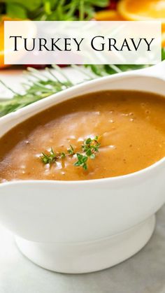 a white bowl filled with soup and garnished with parsley on the side