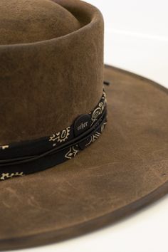 The SRV RELIC HAT is a must-have bolero for any fan of the legendary Stevie Ray Vaughn. Handcrafted from 100% Merino wool, this hat features a cotton headband, 10cm stiff brim, and adjustable fit for maximum comfort.  

The bespoke customisation and original hand and flame relicing wax techniques create a unique, vintage-inspired look that is sure to turn heads. The hat is finished with a vintage bandana and our signature guitar pic, adding a touch of rock and roll edge to any outfit. Whether yo Wide Brim Hat Men, News Boy Cap, Guitar Pic, Black Wide Brim Hat, Mens Hats Vintage, Stevie Ray Vaughn, Signature Guitar, Vintage Bandana, Guitar Pics