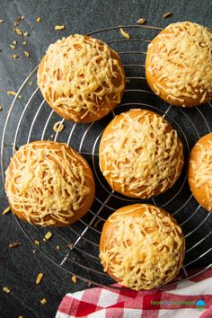 six pastries are sitting on a wire rack