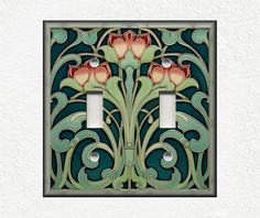 a decorative light switch cover with flowers on it