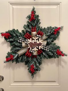 a christmas wreath hanging on the front door